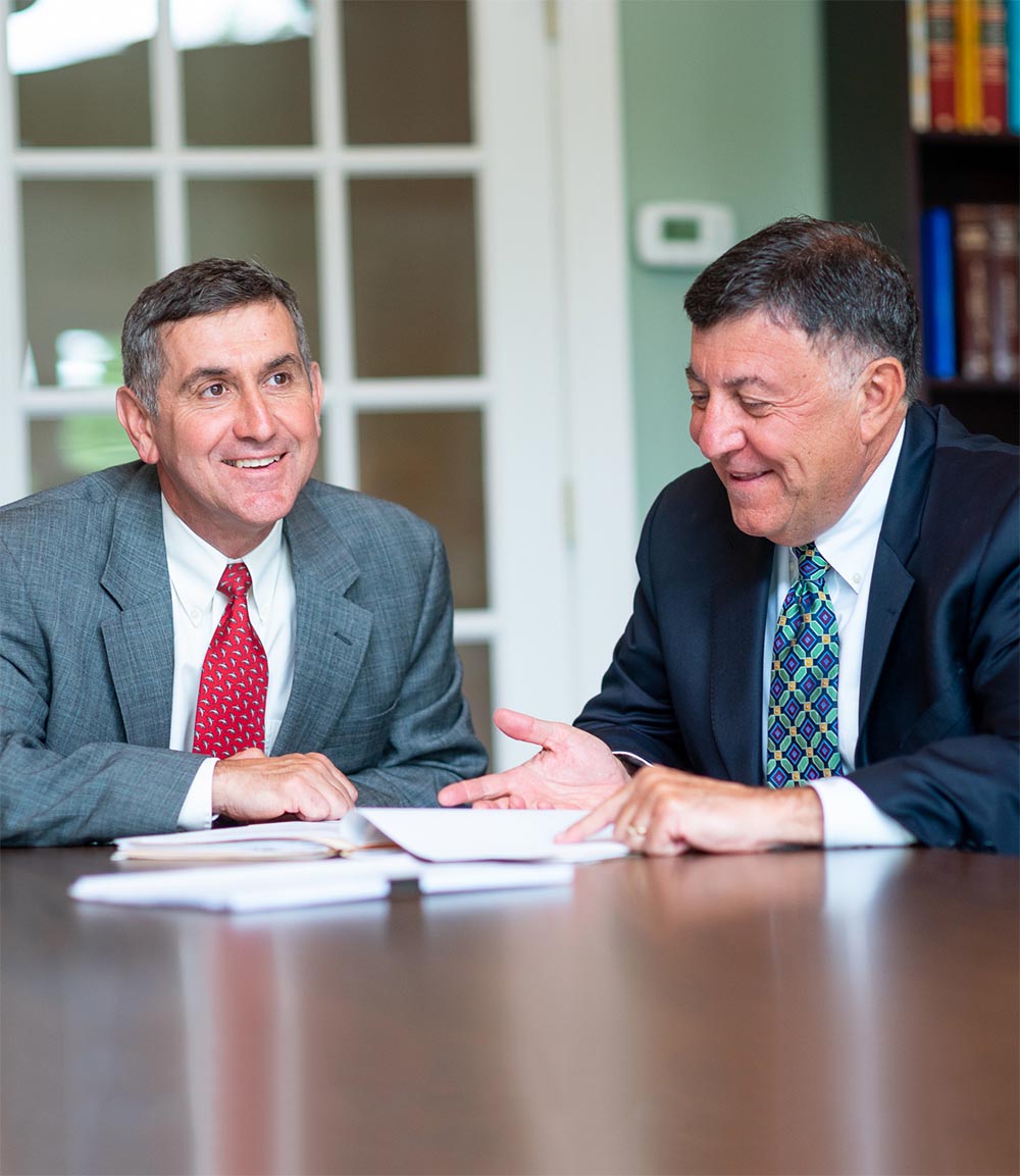 Crowley Wealth Management advisors consulting together in an office conference room